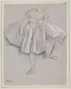 Danseuse rajustant son chausson av Edgar Degas