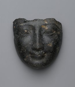 Ansikte från ett sarkofaglock, köpt i Luxor, New Kingdom (granit)