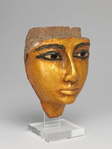 Ansikte från en kista, med ögon och ögonbryn inlagda, förgyllda av Egyptian 20th Dynasty