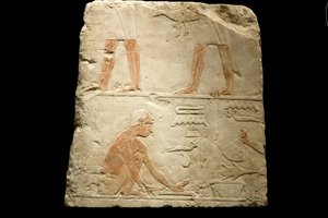 Fragment av en relief som visar matlagning (kalksten)