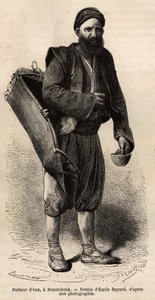 En vattenbärare, kringresande köpman som poserar med sin utrustning, en slags tanklåda och en behållare som används som mått och bägare, i Roustchouk (Rumänien), gravyr efter teckningen av Emile Bayard, som illustrerar resan till Bulgarien, av Guillaume Le av Emile Antoine Bayard