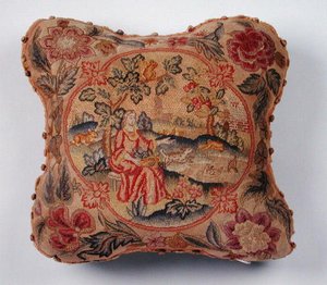 Kudde, broderad i petit point, föreställande en kvinna i ett landskap (textil) av English School