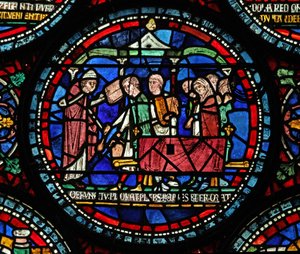 Fönster s6 som visar en scen från ett mirakelfönster från St Thomas Becket: Gilbert de Brun (?) begravning av English School