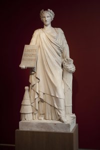den franska republiken. Representerad som en kvinna klädd i ett antikt draperi och med en plakett med mottot "Liberte, Egalite, Fraternite", representerar kupan vid dess fötter fertilitet och ordning, yxan och balken är maktens tecken, denna allegori återg av Ferdinand Taluet