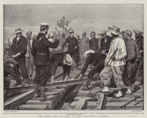 Den händige mannen på jobbet i Kina, som reparerar en järnväg