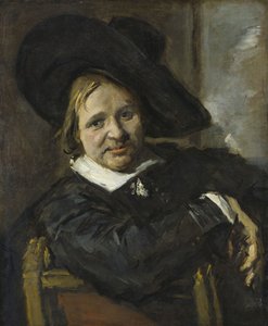 Porträtt av en man som sitter och bär en mjuk hatt av Frans Hals
