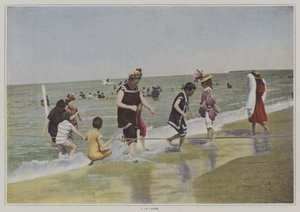 Barn som leker med ett rep på stranden (färgfoto) av French Photographer