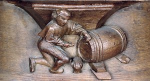 Snideri föreställande en man som sätter en kran på en tunna, från en körstall från klostret St. Lucien i Beauvais (trä)