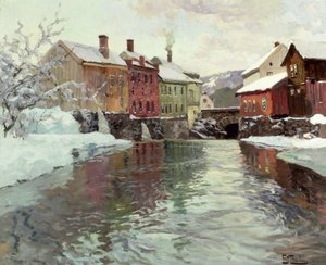 Snötäckta byggnader vid en flod