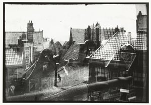 Utsikt över hustaken i Amsterdam av George Hendrik Breitner