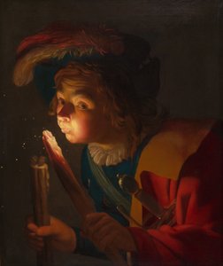 En pojke som blåser på en brand av Gerrit van Honthorst