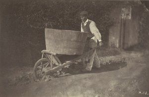Manlig bonde med skottkärra, 1870.