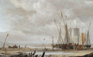En strandscen med fiskebåtar som dras upp