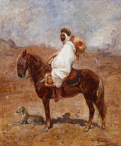 En arab på en häst i ett ökenlandskap