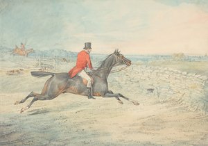 Ryttare på en brun häst som rider mot en mur