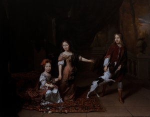 Barn som leker med en hund i ett vardagsrum