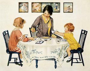 Familjen (mamma och barn) samlades runt ett bord och åt pasta