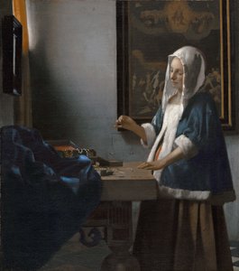 Kvinna som håller en balans av Johannes Vermeer
