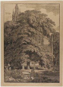 Gotisk kyrka bakom en eklund med gravar av Karl Friedrich Schinkel