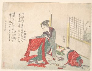 Kvinna som viker tyg av Katsushika Hokusai