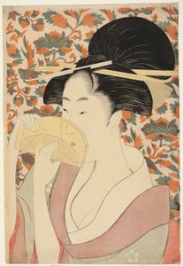 Kvinna som håller ett sköldpadda-skal hår-kam av Kitagawa Utamaro