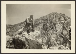 [Man Atop Rocks] av Louis Fleckenstein