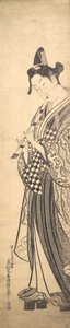 Ung man som går mot vänster på High Geta och spelar flöjt medan han går, ca. ..., ca. 1745. av Okumura Masanobu