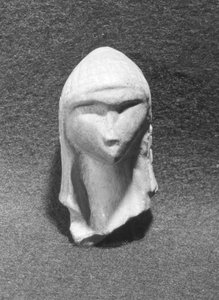 Kvinnohuvud, känt som Venus från Brassempouy, ca 21000 f.Kr.