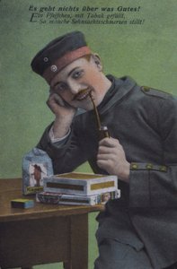 Tysk soldat röker sin pipa (färgad bild) av Photographer German