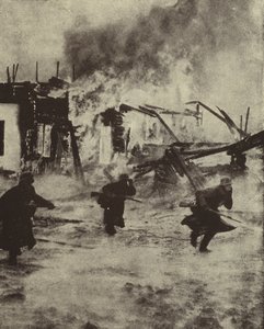 Tyska soldater som rycker fram genom de brinnande ruinerna av Rotterdam efter dess bombning av Luftwaffe, andra världskriget, maj 1940 (s/v foto) av Photographer German