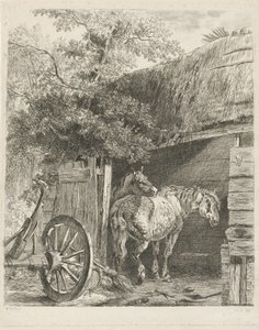 Två hästar i en lada