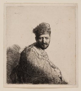 Skäggig man, i pälsad orientalisk mössa och mantel av Rembrandt van Rijn
