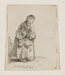 Tiggarkvinna lutad mot en käpp av Rembrandt van Rijn
