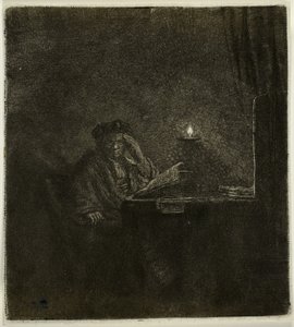 Student vid ett bord vid levande ljus av Rembrandt van Rijn