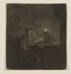 Student vid ett bord i stearinljusets sken av Rembrandt van Rijn