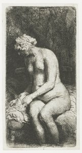 Kvinna som badar fötterna vid en bäck av Rembrandt van Rijn