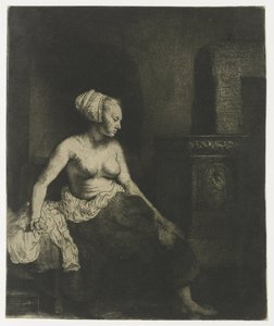 Kvinna som sitter halvklädd bredvid en spis av Rembrandt van Rijn