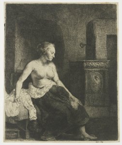 Kvinna som sitter halvklädd bredvid en spis av Rembrandt van Rijn