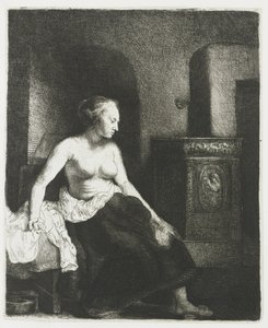 Kvinna som sitter halvklädd bredvid en spis av Rembrandt van Rijn