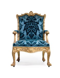 En av ett par George III fåtöljer i förgyllt trä av Robert Adam
