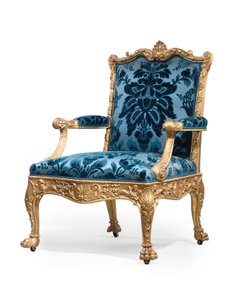 En av ett par George III fåtöljer i förgyllt trä av Robert Adam