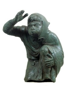 Romersk konst: bronsstatyett av svart slav som knäböjer och blåser. 2:a eller 3:e århundradet e.Kr. Paris, Louvren av Roman