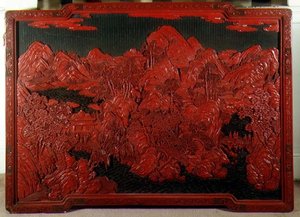 Skulptur på grön botten av en väggplakett av School Chinese