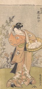 Skådespelaren Onoya Matsusuke, i kvinnlig mantel av O-Kane, justerar kammen i håret, 17..., 1735-1785.