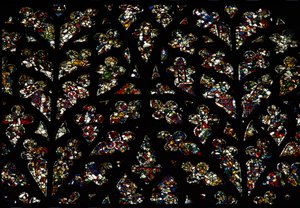 Abstrakta mönster av fragment av målat glas från 1200-talet i Bishops eye window, South Rose