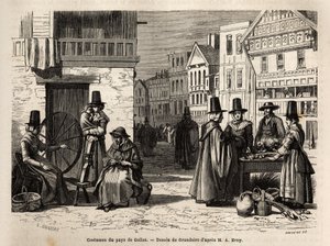 En gata i Wales, med lokalbefolkningen klädda i traditionella dräkter och vardagsaktiviteter: en förstahandsfamilj och kvinnor som spinner ull med hjul. Engravure pour illustrrer un voyage dans le pays de Wales, en 1862, par Alfred Erny, i "Le tour du mond av Unknown artist