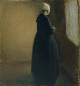 En gammal kvinna som står vid ett fönster av Vilhelm Hammershøi