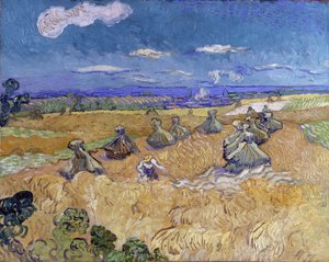 Vetefält med kärvar och skördare av Vincent van Gogh