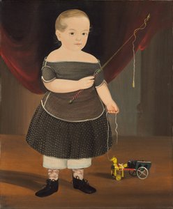 Pojke med leksakshäst och vagn