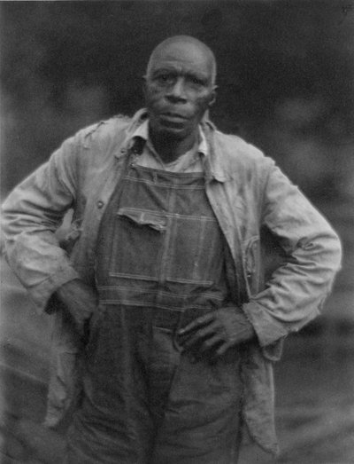 Man i overall av American Photographer